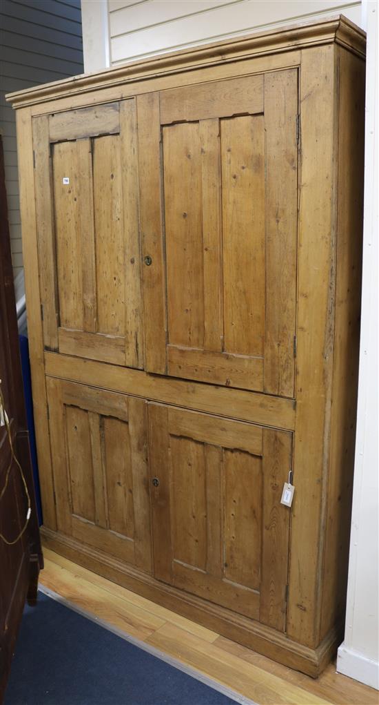 A 19th century pine panelled cupboard W.143cm